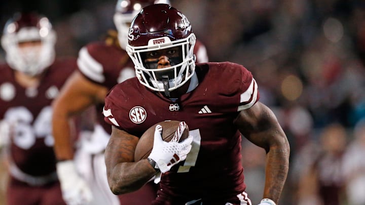 Mississippi State Bulldogs running back Jo'Quavious Marks (7) runs the ball  during the second half against the Ole Miss Rebels at Davis Wade Stadium at Scott Field.