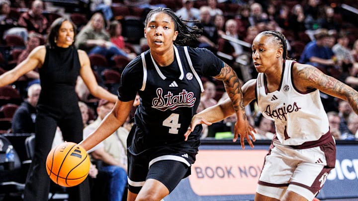 Mississippi State senior guard Trayanna Crisp drives past a Texas A&M defender during Thursday night's game against the Aggies. 