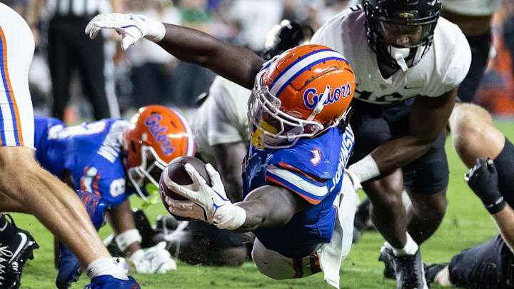 Oct 5, 2024; Gainesville, Florida, USA; Florida Gators running back Montrell Johnson Jr. (1) scores a touchdown against the UCF Knights during the first half at Ben Hill Griffin Stadium. Mandatory Credit: Matt Pendleton-Imagn Images