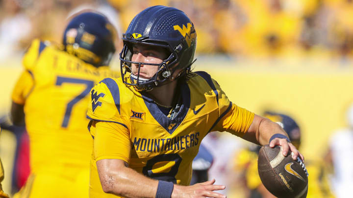 Aug 30, 2025; Morgantown, West Virginia, USA; West Virginia Mountaineers quarterback Nicco Marchiol (8) throws a pass during the third quarter against the Robert Morris Colonials at Milan Puskar Stadium. Mandatory Credit: Ben Queen-Imagn Images