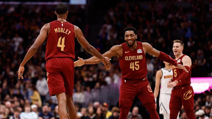 Dec 27, 2024; Denver, Colorado, USA; Cleveland Cavaliers guard Donovan Mitchell (45) reacts with forward Evan Mobley (4) after a play in the fourth quarter against the Denver Nuggets at Ball Arena. Mandatory Credit: Isaiah J. Downing-Imagn Images