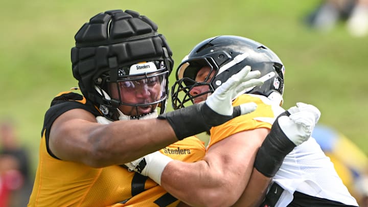 Jul 25, 2025; Pittsburgh, PA, USA; Pittsburgh Steelers defensive tackle Derrick Harmon (99) battles center Zach Frazier (54) during drills during training camp at Saint Vincent College. Mandatory Credit: Barry Reeger-Imagn Images