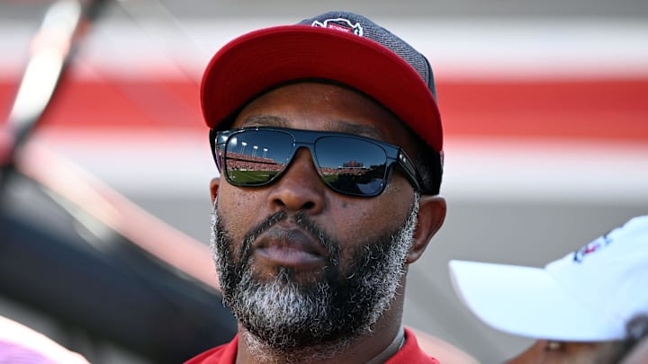Oct 28, 2023; Raleigh, North Carolina, USA; Former North Carolina State Wolfpack receiver Torry Holt looks on during the first half against the Clemson Tigers at Carter-Finley Stadium. Mandatory Credit: Rob Kinnan-Imagn Images