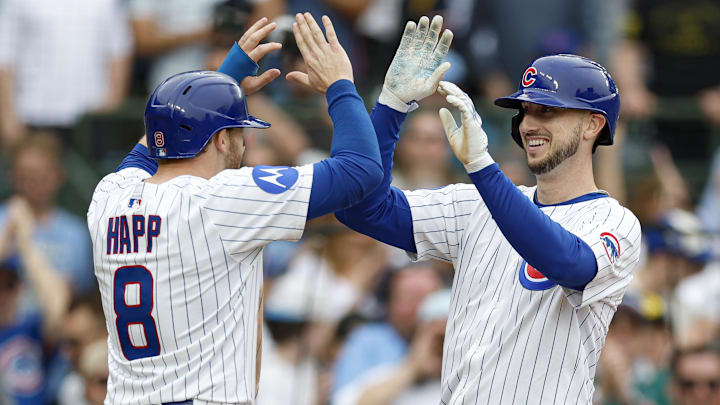 Apr 18, 2025; Chicago, Illinois, USA; Chicago Cubs outfielder Kyle Tucker (30) celebrates with outfielder Ian Happ (8) after hitting a two-run home run against the Arizona Diamondbacks during the eighth inning at Wrigley Field.