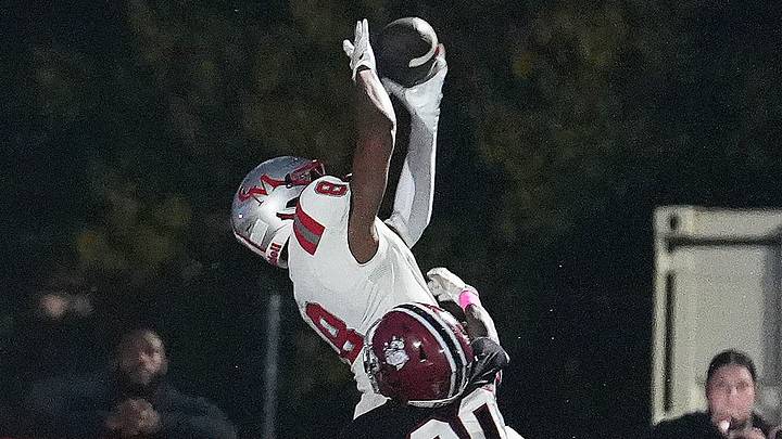 Ramar Thomas of Catholic Memorial makes the touchdown catch against Max Raymond of Brockton during their game on Friday, Oct. 2, 2026.