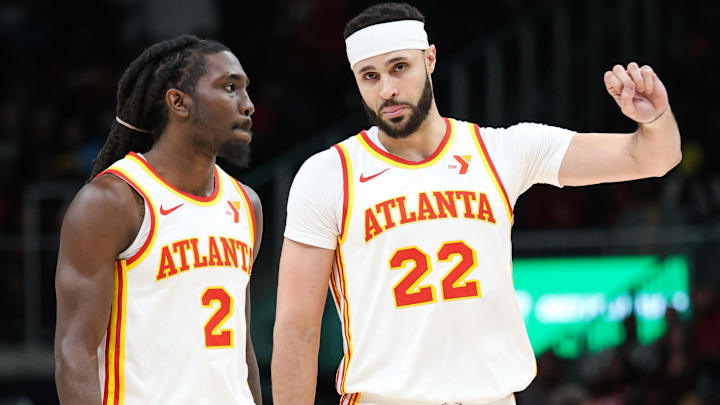 Atlanta Hawks guard Keaton Wallace (2) and forward Larry Nance Jr. (22) talk in the game against the Memphis Grizzlies during the first half at State Farm Arena.