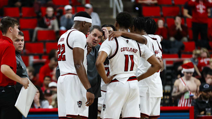 Dec 6, 2025; Raleigh, North Carolina, USA; NC State Wolfpack huddle with head coach Will Wade during the second half of the game against UNC Asheville Bulldogs at Lenovo Center. Mandatory Credit: Jaylynn Nash-Imagn Images
