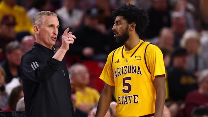 Jan 24, 2026; Tempe, Arizona, USA; Arizona State Sun Devils guard Maurice Odum (5) with head coach Bobby Hurley against the Cincinnati Bearcats in the second half at Desert Financial Arena. Mandatory Credit: Mark J. Rebilas-Imagn Images