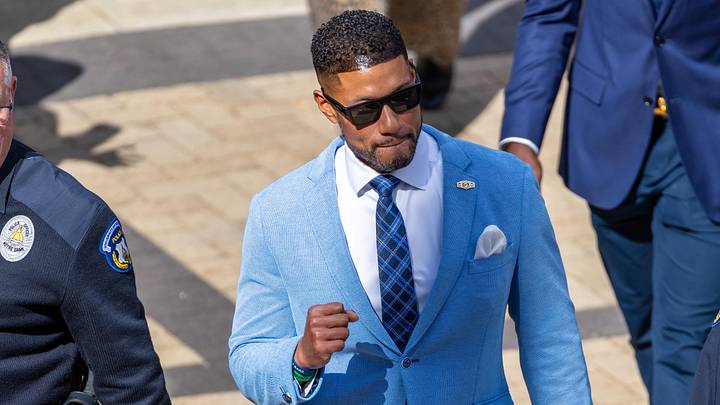 Oct 11, 2025; South Bend, Indiana, USA; Notre Dame Fighting Irish head coach Marcus Freeman gestures towards fans as he leads the team to the stadium before facing the NC State Wolfpack at Notre Dame Stadium.