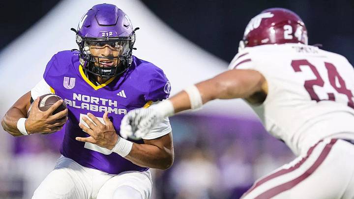 North Alabama quarterback Destin Wade looks for running room. North Alabama quarterback Destin Wade looks for running room.