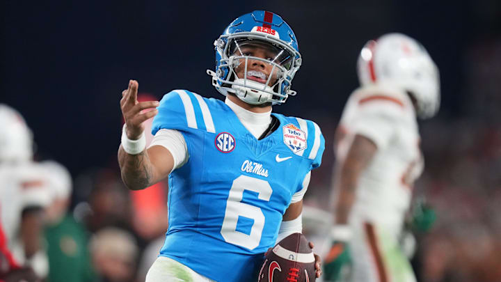 Ole Miss Rebels quarterback Trinidad Chambliss (6) signals a first down after his run against the Miami Hurricanes during their Vrbo Fiesta Bowl matchup at State Farm Stadium on Jan. 8, 2026.