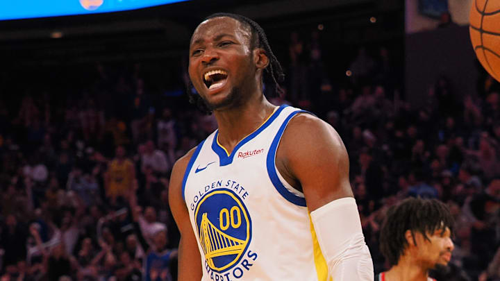 Dec 6, 2023; San Francisco, California, USA; Golden State Warriors forward Jonathan Kuminga (00) reacts after a dunk against the Portland Trail Blazers during the fourth quarter at Chase Center. Mandatory Credit: Kelley L Cox-Imagn Images