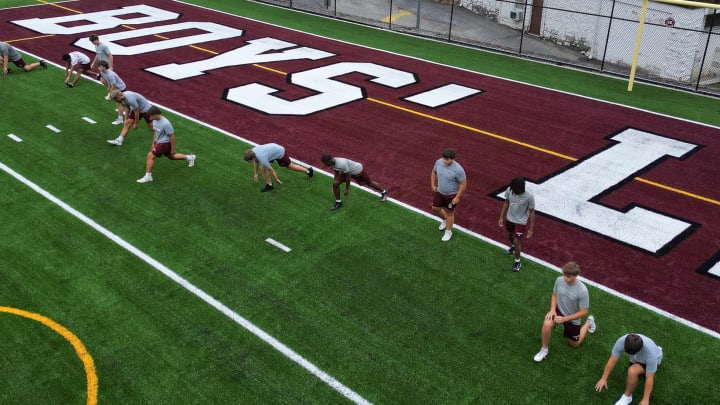 Boys' Latin football players go through a preseason workout on the newly turf surface on J. Duncan Smith Field. Boys' Latin football players go through a preseason workout on the newly turf surface on J. Duncan Smith Field.
