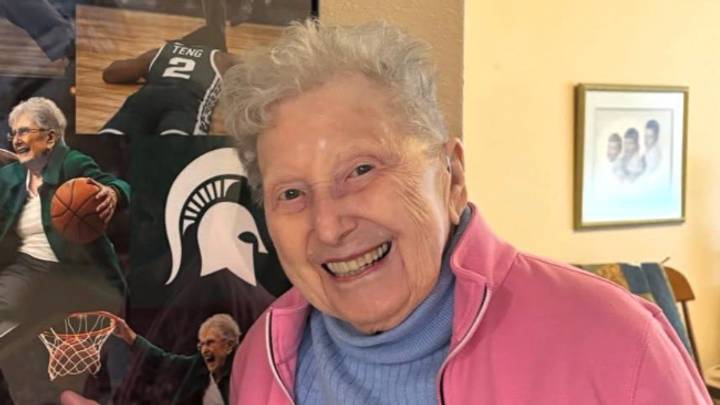 Dorothy Izzo poses in front of an AI-generated photo of her playing 1-on-1 against Kur Teng shortly after Tom Izzo's viral "you couldn't guard my mother" line. Dorothy Izzo poses in front of an AI-generated photo of her playing 1-on-1 against Kur Teng shortly after Tom Izzo's viral "you couldn't guard my mother" line.