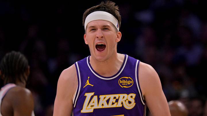 Feb 5, 2026; Los Angeles, California, USA;  Los Angeles Lakers guard Austin Reaves (15) reacts at the buzzer defeating the Philadelphia 76ers at Crypto.com Arena. Mandatory Credit: Jayne Kamin-Oncea-Imagn Images