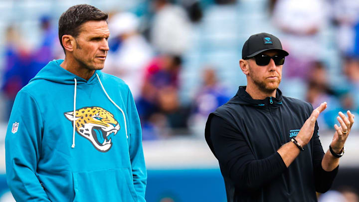 Jacksonville Jaguars Executive Vice President of Football Operations Tony Boselli, left and Jacksonville Jaguars head coach Liam Coen watch warm up before an NFL football AFC Wild Card playoff matchup, Sunday, Jan. 11, 2026, in Jacksonville, Fla. Bills lead 10-7 at the half over the Jaguars. [Doug Engle/Florida Times-Union]