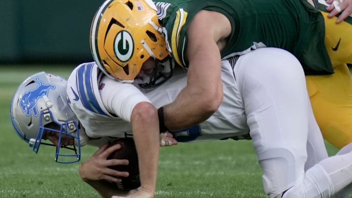 Green Bay Packers defensive end Lukas Van Ness (90) sacks Detroit Lions quarterback Jared Goff (16) 