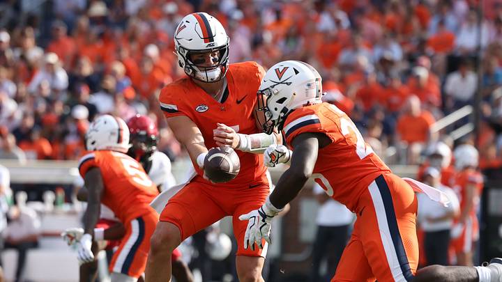 Aug 29, 2026; Charlottesville, Virginia, USA; Virginia Cavaliers quarterback Beau Pribula (7) hands off to running back Xay Davis (25) during the third quarter of the game against the North Carolina State Wolfpack at Scott Stadium. Mandatory Credit: Greg Atkins-Imagn Images Aug 29, 2026; Charlottesville, Virginia, USA; Virginia Cavaliers quarterback Beau Pribula (7) hands off to running back Xay Davis (25) during the third quarter of the game against the North Carolina State Wolfpack at Scott Stadium. Mandatory Credit: Greg Atkins-Imagn Images