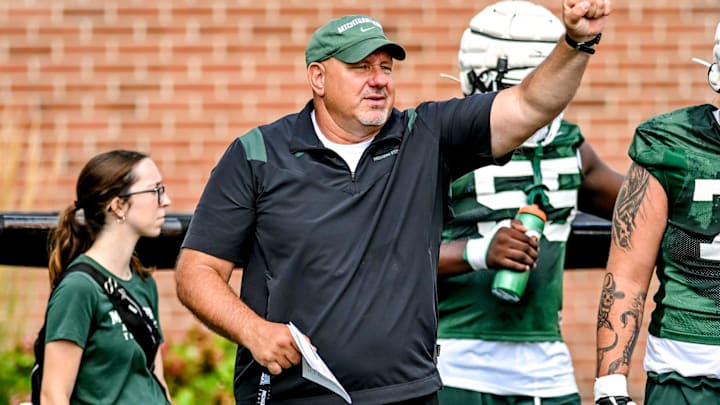 Michigan State's offensive line coach Jim Michalczik works with the team during the first day of football camp on Tuesday, July 30, 2024, in East Lansing. Michigan State's offensive line coach Jim Michalczik works with the team during the first day of football camp on Tuesday, July 30, 2024, in East Lansing.