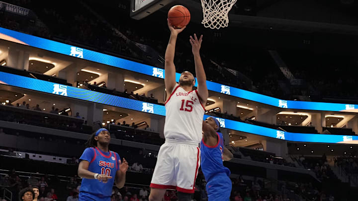 Mar 11, 2026; Charlotte, NC, USA; Louisville Cardinals center Aly Khalifa (15) shoots against the Southern Methodist University Mustangs during the first half at Spectrum Center. Mandatory Credit: Jim Dedmon-Imagn Images