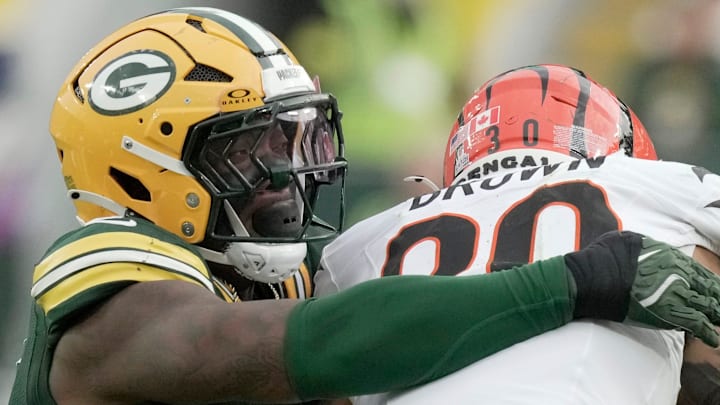 Green Bay Packers linebacker Quay Walker (7) tackles Cincinnati Bengals running back Chase Brown. Green Bay Packers linebacker Quay Walker (7) tackles Cincinnati Bengals running back Chase Brown.