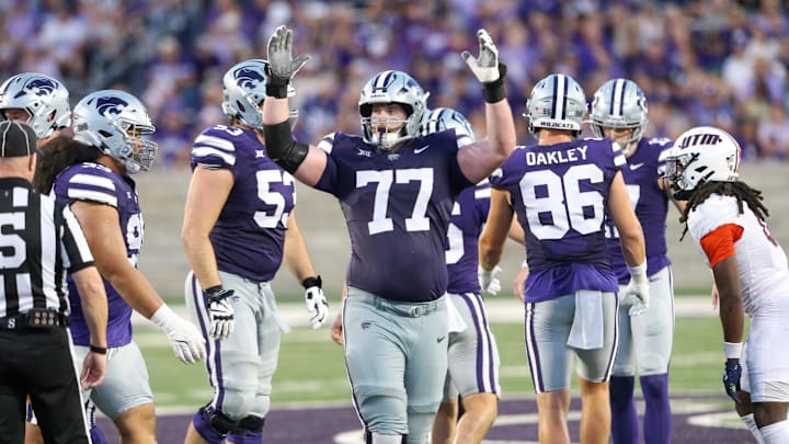 Aug 31, 2024; Manhattan, Kansas, USA; Kansas State Wildcats offensive lineman Carver Willis (77) celebrates a field goal during the third quarter against the Tennessee-Martin Skyhawks at Bill Snyder Family Football Stadium. Mandatory Credit: Scott Sewell-Imagn Images
