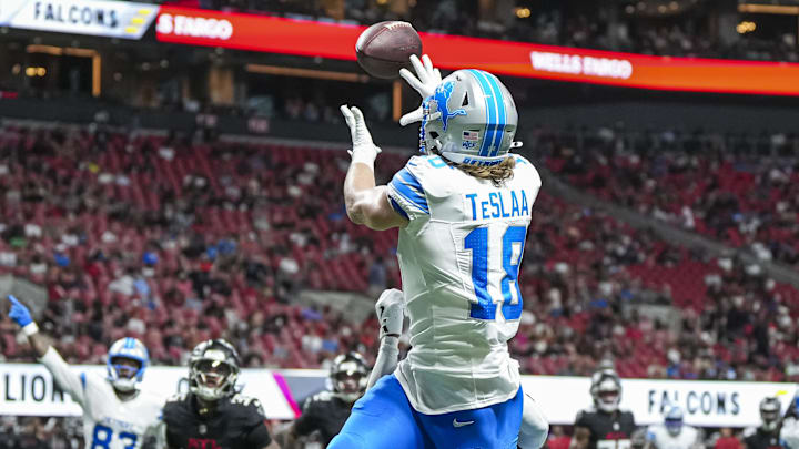Aug 8, 2025; Atlanta, Georgia, USA; Detroit Lions wide receiver Isaac TeSlaa (18) catches a touchdown pass behind Atlanta Falcons cornerback Dee Alford (20) during the second quarter at Mercedes-Benz Stadium. Mandatory Credit: Dale Zanine-Imagn Images
