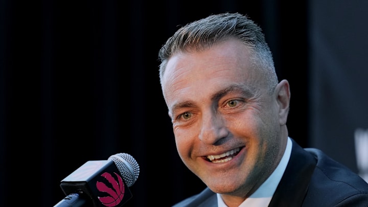 Toronto Raptors head coach Darko Rajakovic smiles.