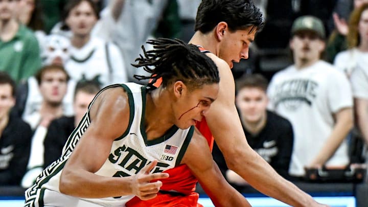 Michigan State's Jordan Scott, left, pressures Illinois' Andrej Stojakovic during the first half on Saturday, Feb. 7, 2026, at the Breslin Center in East Lansing.