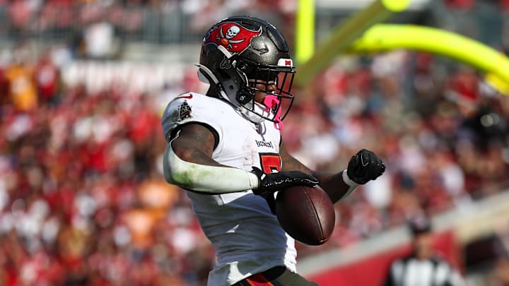 Nov 10, 2024; Tampa, Florida, USA; Tampa Bay Buccaneers running back Bucky Irving (7) scores a touchdown against the San Francisco 49ers in the fourth quarter at Raymond James Stadium. Mandatory Credit: Nathan Ray Seebeck-Imagn Images