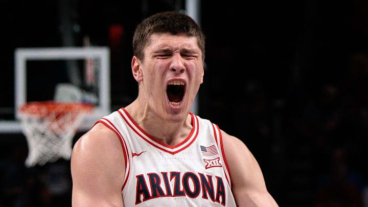 Mar 13, 2026; Kansas City, MO, USA; Arizona Wildcats forward Ivan Kharchenkov (8) reacts after a play during the second half against the Iowa State Cyclones at T-Mobile Center. Mandatory Credit: William Purnell-Imagn Images