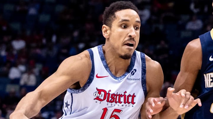 Jan 3, 2025; New Orleans, Louisiana, USA;  Washington Wizards guard Malcolm Brogdon (15) dribbles against New Orleans Pelicans guard Trey Murphy III (25) during the first half at Smoothie King Center. Mandatory Credit: Stephen Lew-Imagn Images