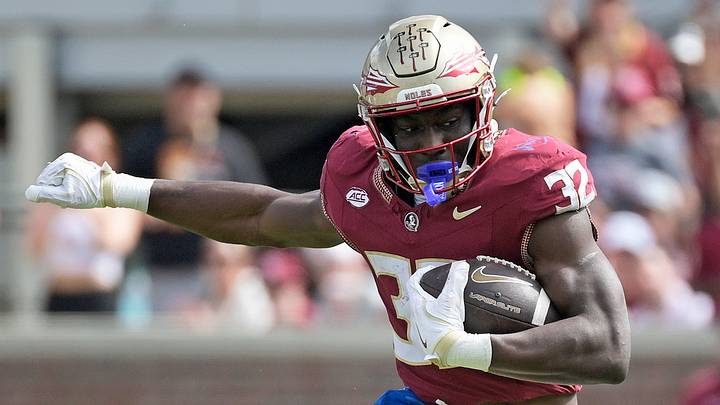 Oct 11, 2025; Tallahassee, Florida, USA; Florida State Seminoles running back Ousmane Kromah (32) is tackled by Pittsburgh Panthers linebacker Braylan Lovelace (0) during the second half at Doak S. Campbell Stadium. Mandatory Credit: Melina Myers-Imagn Images