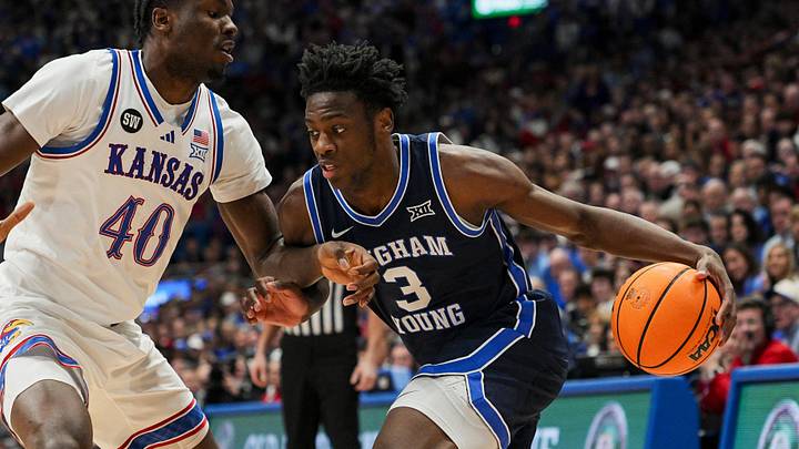 Jan 31, 2026; Lawrence, Kansas, USA; BYU Cougars forward AJ Dybantsa (3) drives against Kansas Jayhawks forward Flory Bidunga (40) during the first half at Mizzou Arena. Mandatory Credit: Jay Biggerstaff-Imagn Images Jan 31, 2026; Lawrence, Kansas, USA; BYU Cougars forward AJ Dybantsa (3) drives against Kansas Jayhawks forward Flory Bidunga (40) during the first half at Mizzou Arena. Mandatory Credit: Jay Biggerstaff-Imagn Images