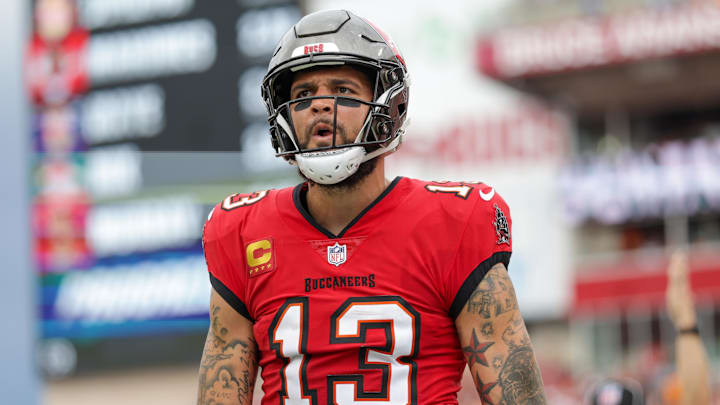 Dec 29, 2024; Tampa, Florida, USA; Tampa Bay Buccaneers wide receiver Mike Evans (13) celebrates after catching a pass for a two point conversion against the Carolina Panthers in the second quarter at Raymond James Stadium. Mandatory Credit: Nathan Ray Seebeck-Imagn Images