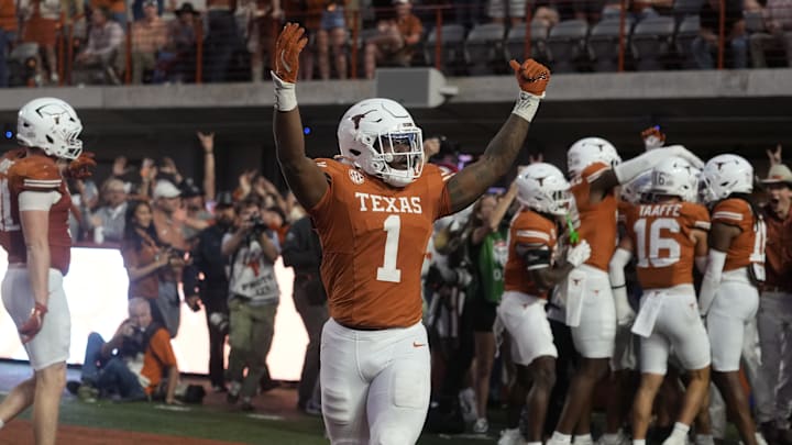 Texas Longhorns defensive lineman Colin Simmons (1) reacts after a fumble was recovered for a touchdown during the second half against the Arkansas Razorbacks at Darrell K Royal-Texas Memorial Stadium.