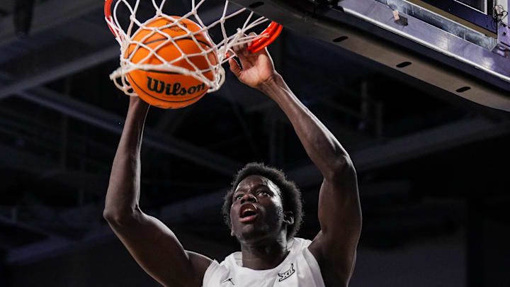Cincinnati Bearcats center Moustapha Thiam (52) dunks the ball against the UCF Knights in the first half at Fifth Third Arena. 