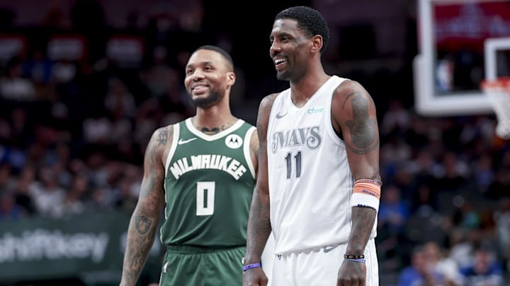 Mar 1, 2025; Dallas, Texas, USA;  Dallas Mavericks guard Kyrie Irving (11) laughs with Milwaukee Bucks guard Damian Lillard (0) during the second half at American Airlines Center. Mandatory Credit: Kevin Jairaj-Imagn Images