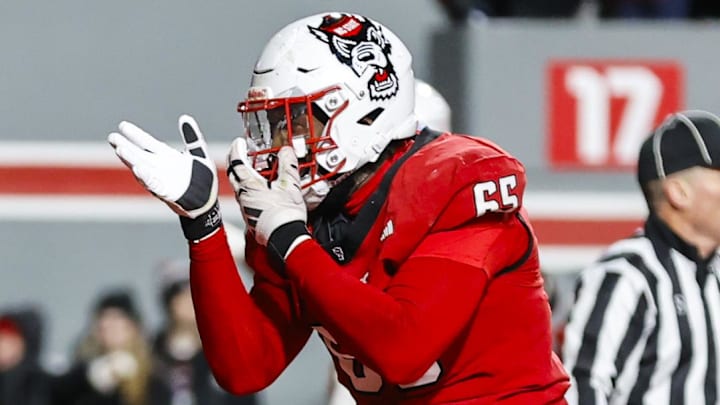Nov 29, 2025; Raleigh, North Carolina, USA; NC State Wolfpack offensive lineman Jacarrius Peak (65) celebrates at the end zone during the second half of the game against North Carolina Tar Heels at Carter-Finley Stadium. Mandatory Credit: Jaylynn Nash-Imagn Images Nov 29, 2025; Raleigh, North Carolina, USA; NC State Wolfpack offensive lineman Jacarrius Peak (65) celebrates at the end zone during the second half of the game against North Carolina Tar Heels at Carter-Finley Stadium. Mandatory Credit: Jaylynn Nash-Imagn Images