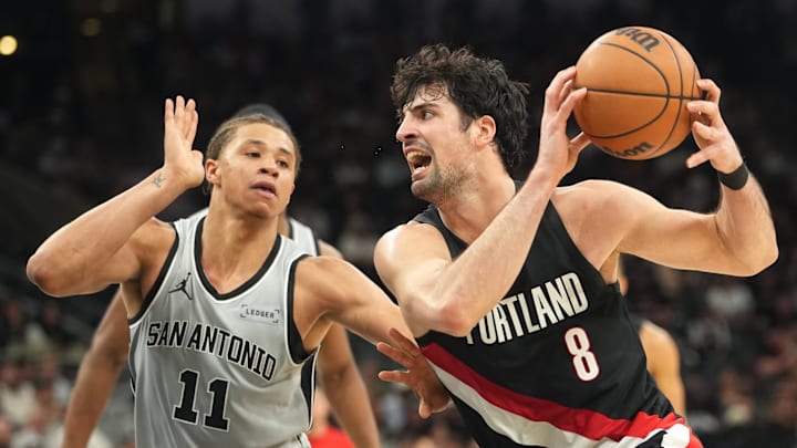 Apr 8, 2026; San Antonio, Texas, USA; Portland Trail Blazers forward Deni Avdija (8) drives to the basket against San Antonio Spurs forward Carter Bryant (11) during the second half at Frost Bank Center.