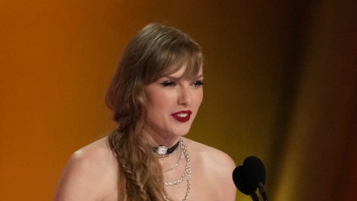 Taylor Swift accepts the award during the 66th Annual Grammy Awards