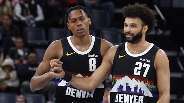 Nov 24, 2025; Memphis, Tennessee, USA; Denver Nuggets guard Peyton Watson (8) reacts with guard Jamal Murray (27) during the fourth quarter against the Memphis Grizzlies at FedExForum.