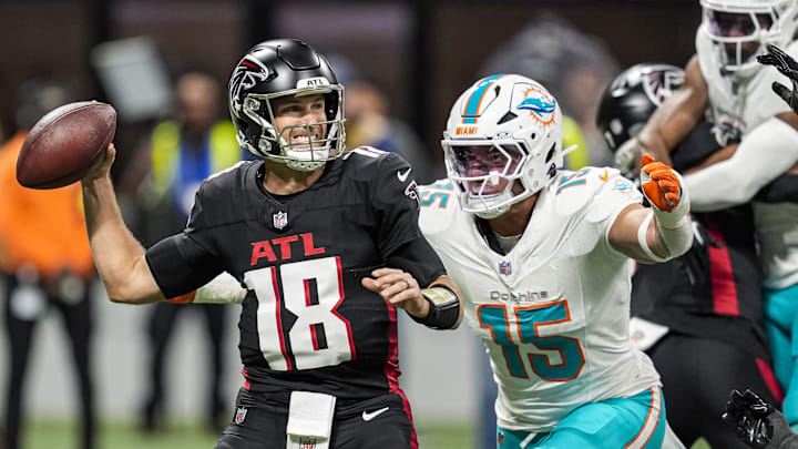 Oct 26, 2025; Atlanta, Georgia, USA; Atlanta Falcons quarterback Kirk Cousins (18) passes under pressure from Miami Dolphins linebacker Jaelan Phillips (15) during the first quarter at Mercedes-Benz Stadium. Mandatory Credit: Dale Zanine-Imagn Images Oct 26, 2025; Atlanta, Georgia, USA; Atlanta Falcons quarterback Kirk Cousins (18) passes under pressure from Miami Dolphins linebacker Jaelan Phillips (15) during the first quarter at Mercedes-Benz Stadium. Mandatory Credit: Dale Zanine-Imagn Images