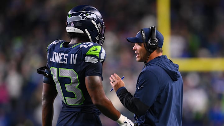 Oct 20, 2025; Seattle, Washington, USA; Seattle Seahawks linebacker Ernest Jones IV (13) talks with Seattle Seahawks head coach Mike Macdonald during the fourth quarter against the Houston Texans at Lumen Field.