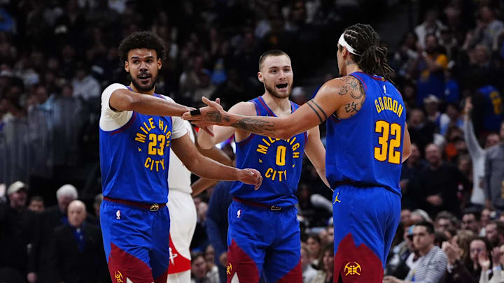 Mar 11, 2026; Denver, Colorado, USA; Denver Nuggets forward Cameron Johnson (23), guard Christian Braun (0) and forward Aaron Gordon (32) reacts in the third quarter against the Houston Rockets at Ball Arena.