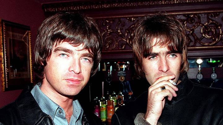 Liam and Noel Gallagher of Oasis stand for a photograph