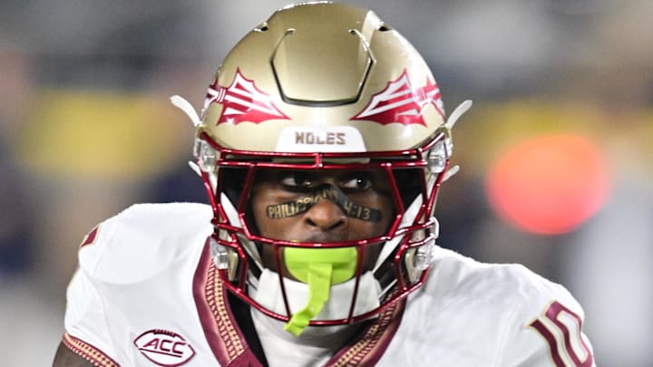 Nov 9, 2024; South Bend, Indiana, USA; Florida State Seminoles wide receiver Malik Benson (10) carries against the Notre Dame Fighting Irish in the first quarter at Notre Dame Stadium. Mandatory Credit: Matt Cashore-Imagn Images