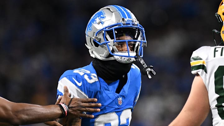 Dec 5, 2024; Detroit, Michigan, USA;  Detroit Lions cornerback Carlton Davis III (23) and Green Bay Packers tight end John FitzPatrick (86) exchange words in the second quarter at Ford Field. Mandatory Credit: Lon Horwedel-Imagn Images