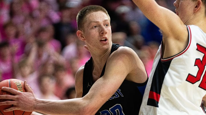 Waukee Northwest's Landon Davis (30) looks to pass to a teammate during the Class 4A semifinal against Cedar Falls on Wednesday, March 12, 2025, at Wells Fargo Arena.