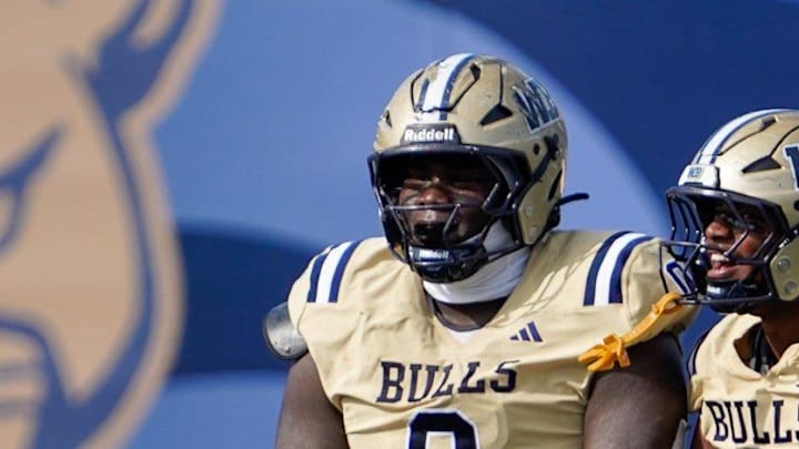 West Boca defenders Jamar Thompson (0), Grant Edmond (9), and Demetrius Geathers Jr. (11) celebrate a sack against West Broward in the second quarter of the 6A State Final at Pitbull Stadium on Dec. 12, 2025, in Miami, FL.